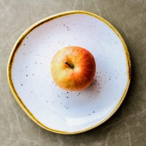 Apple on white plate