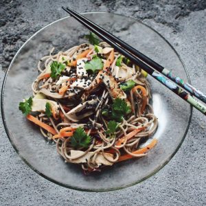 vegetable noodle with chopstick on glass plate
