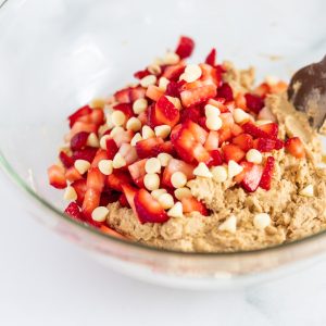 a bowl filled with oatmeal and strawberries