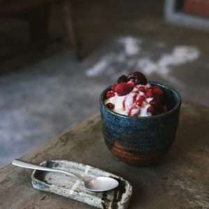 Ice cream with berries in bowl