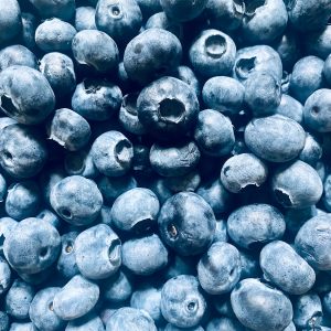a pile of blueberries sitting next to each other