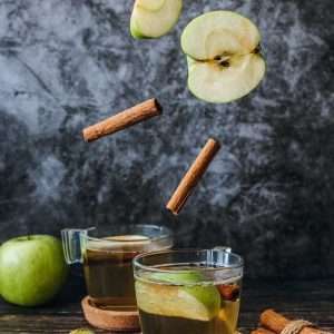 sliced apples on cup with cinamon