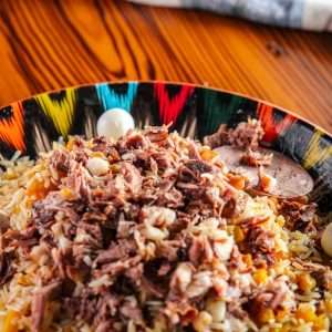 a colorful plate of food on a wooden table