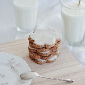 cookies on white ceramic plate beside stainless steel fork