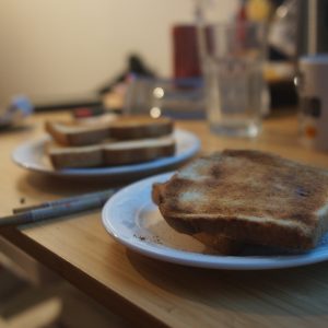 a couple of pieces of toast on a white plate