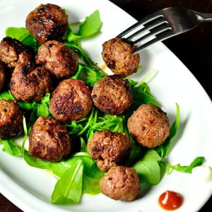 meat balls on oval white plate