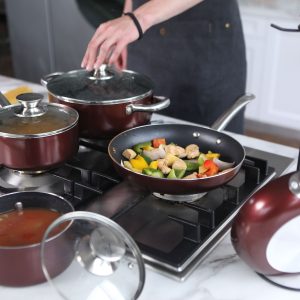 person cooking on stainless steel cooking pot