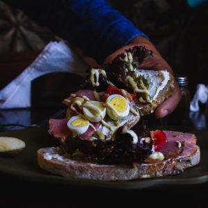 person holding piece of cake