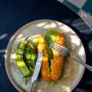 stainless steel fork on green and white ceramic plate