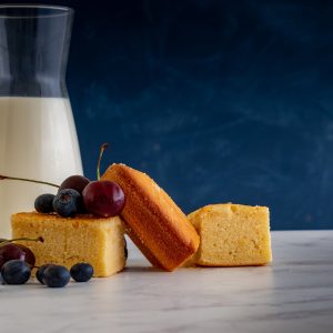 sliced bread and clear drinking glass on white table