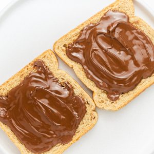 two pieces of bread with chocolate spread on them