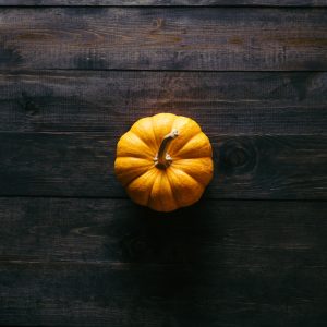 pumpkin on wooden board