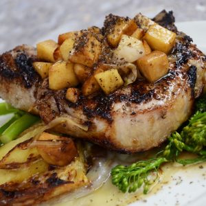 grilled steak with vegetables on white ceramic plate