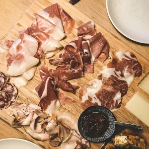 sliced meat on brown wooden chopping board