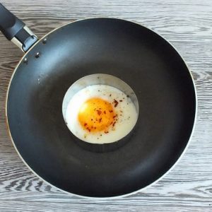 egg on black frying pan