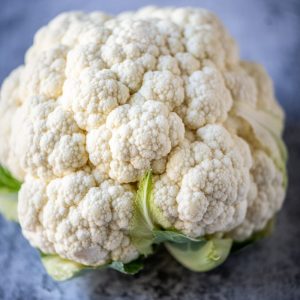 a close up of a cauliflower on a table