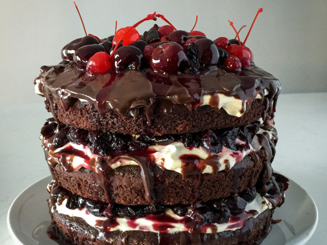 chocolate cake with strawberry on white ceramic plate