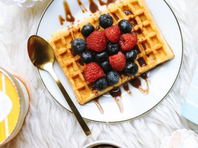 sandwich with strawberry and blackberry fruits on plate