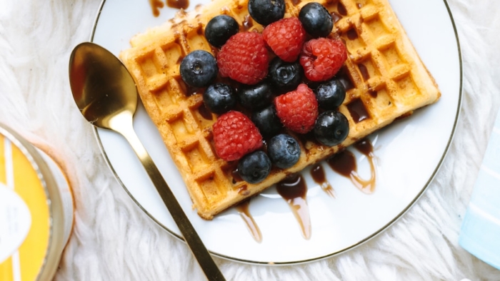 sandwich with strawberry and blackberry fruits on plate